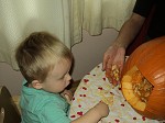 toddlers with pumpkin