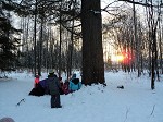 school age kids with deer outdoors